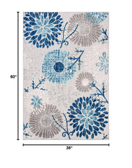 SAFAVIEH Cabana Rug on patio with floral design