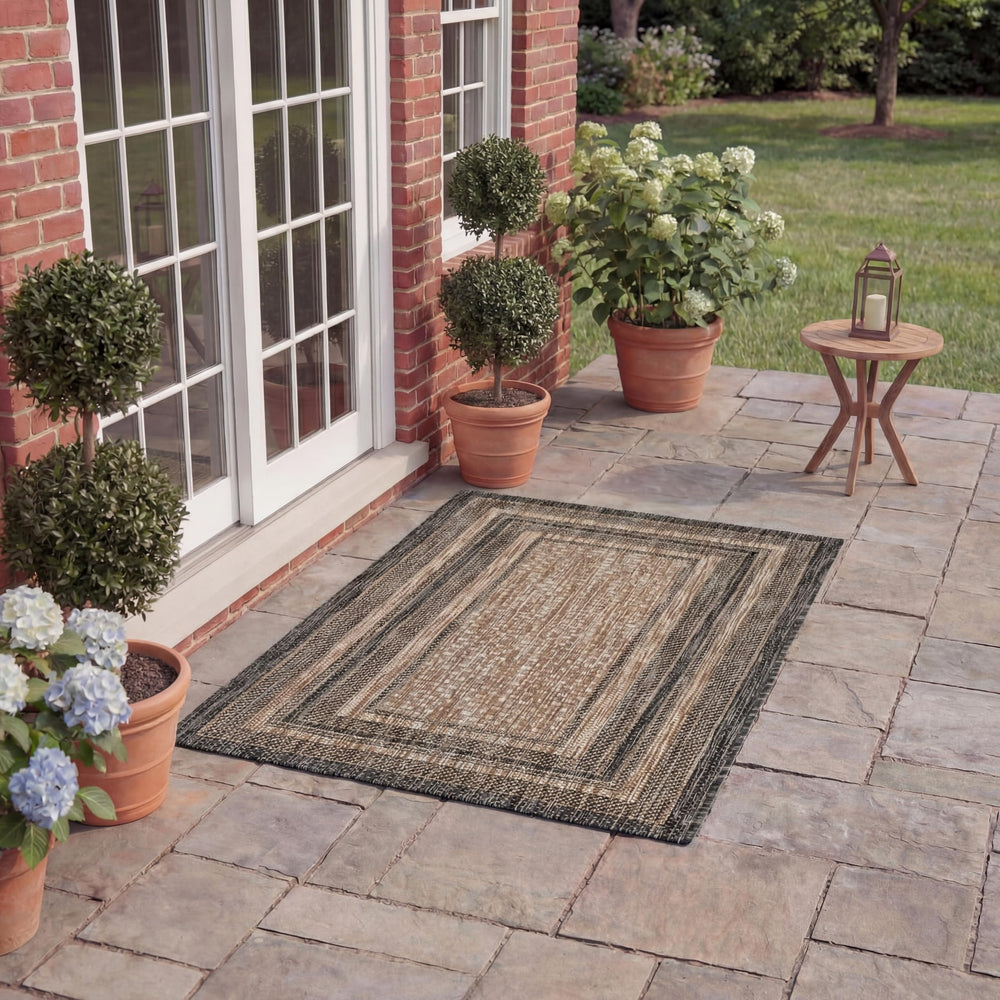 SAFAVIEH Courtyard Outdoor Rug rolled for storage