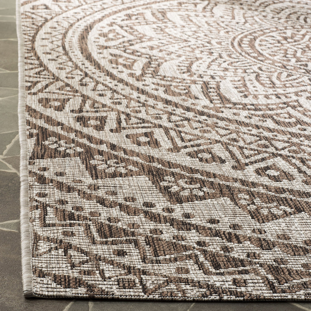 SAFAVIEH Outdoor Rug 3' Square with garden furniture