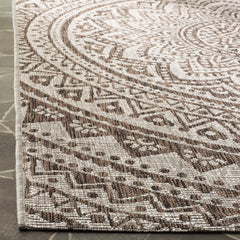 SAFAVIEH Outdoor Rug 3' Square with garden furniture