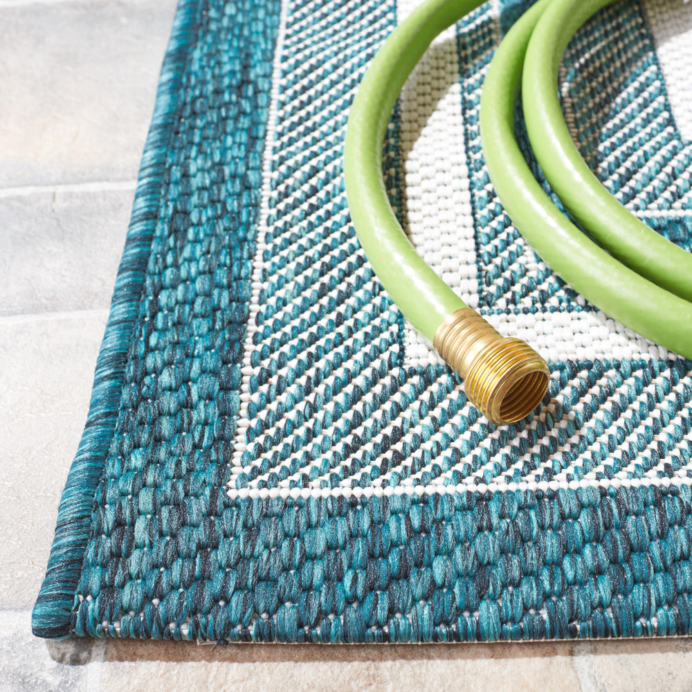 SAFAVIEH Outdoor Rug displayed on a patio setting