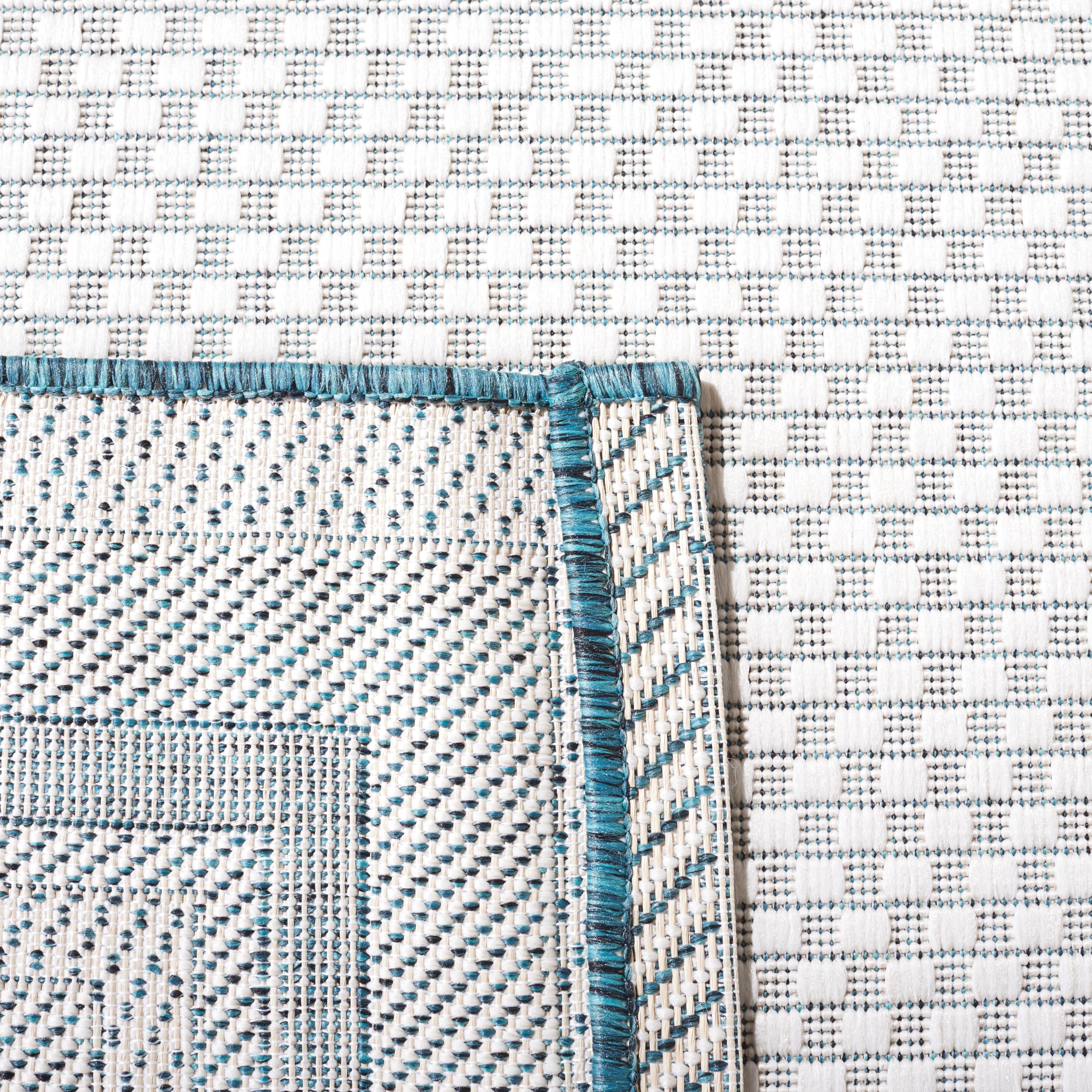 SAFAVIEH Outdoor Rug in a living room layout