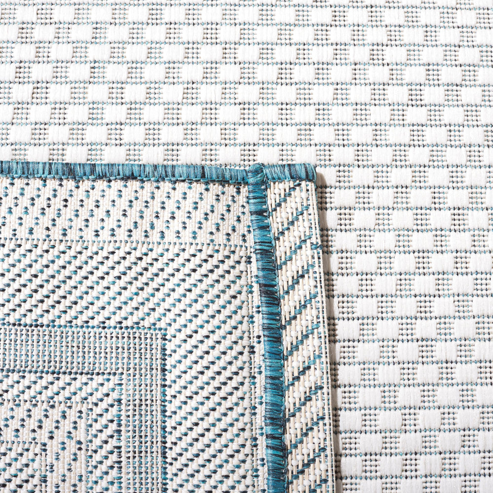 SAFAVIEH Outdoor Rug in a living room layout