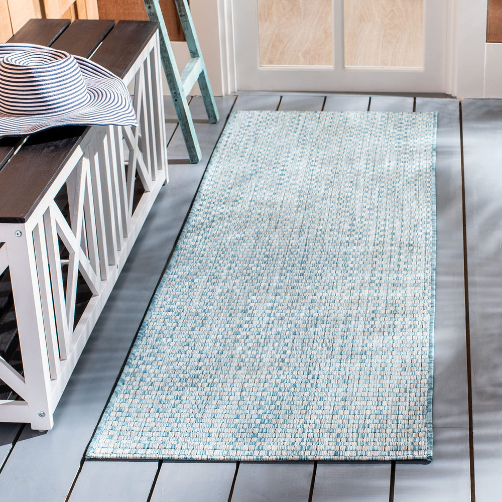 SAFAVIEH Outdoor Runner Rug rolled up for storage