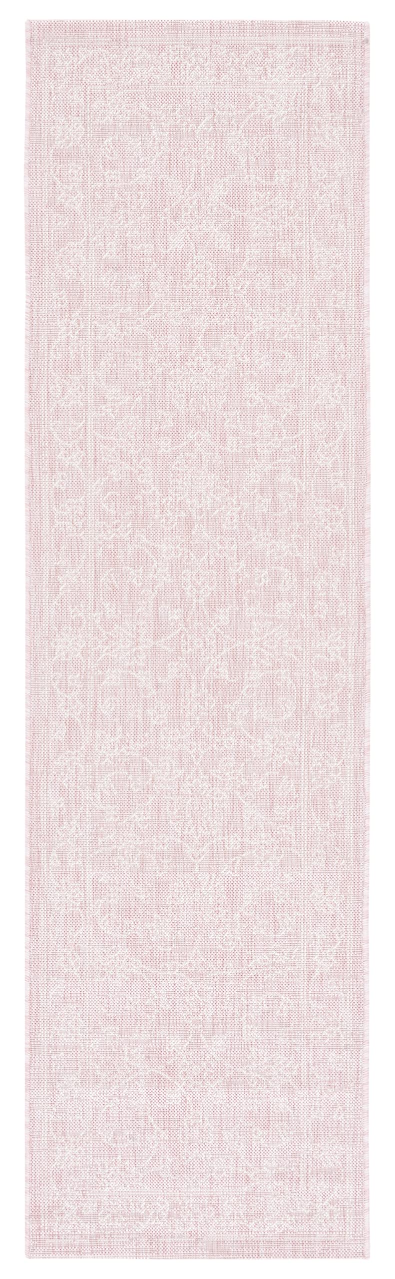 SAFAVIEH Soft Pink/Ivory runner mat in outdoor patio setting
