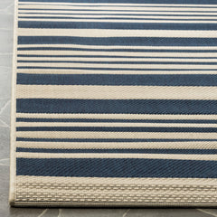 SAFAVIEH Washable Outdoor Rug in patio setting