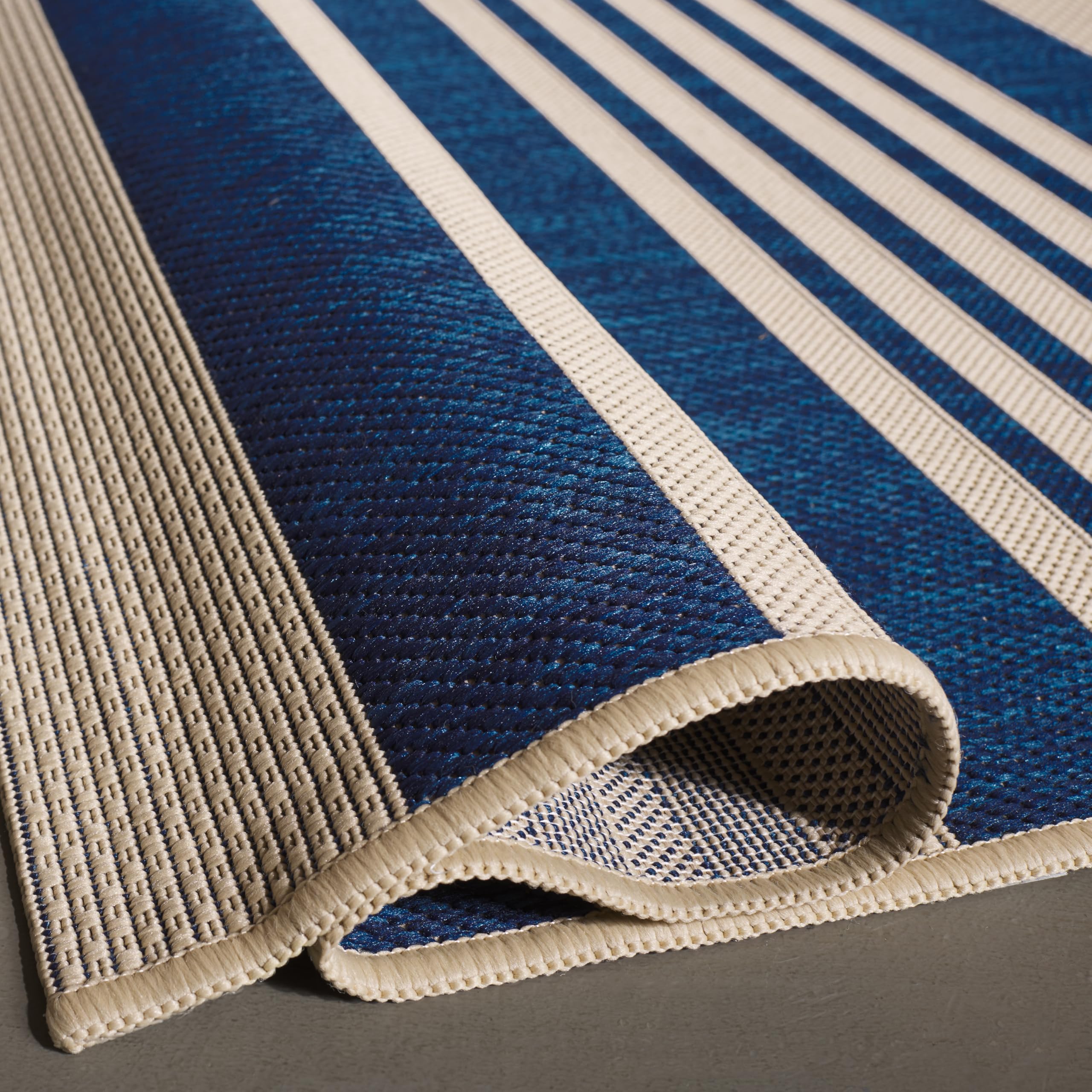 SAFAVIEH Washable Outdoor Rug rolled up for storage