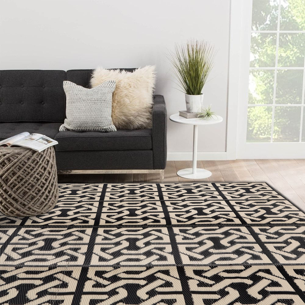 SAND MINE mat showcasing reversible design in black and beige
