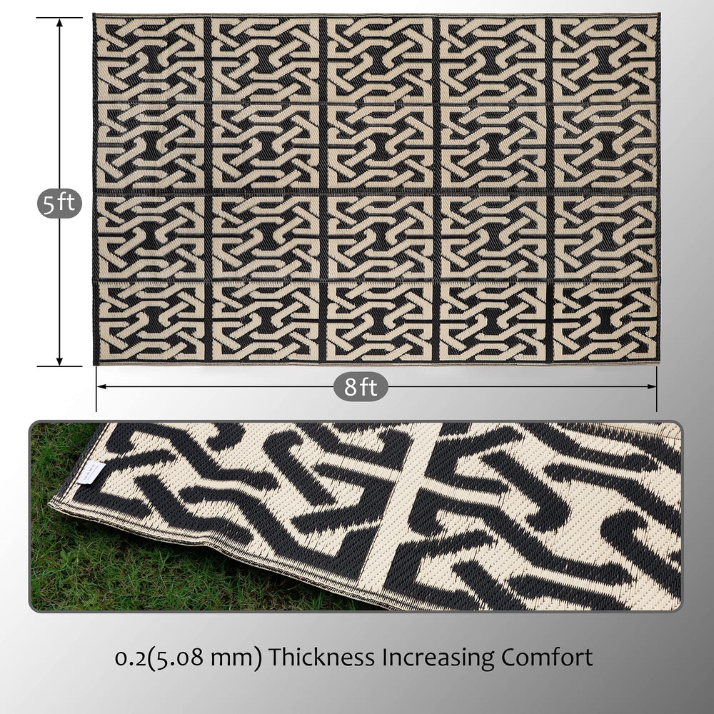 SAND MINE Outdoor Mat set up on a patio with furniture