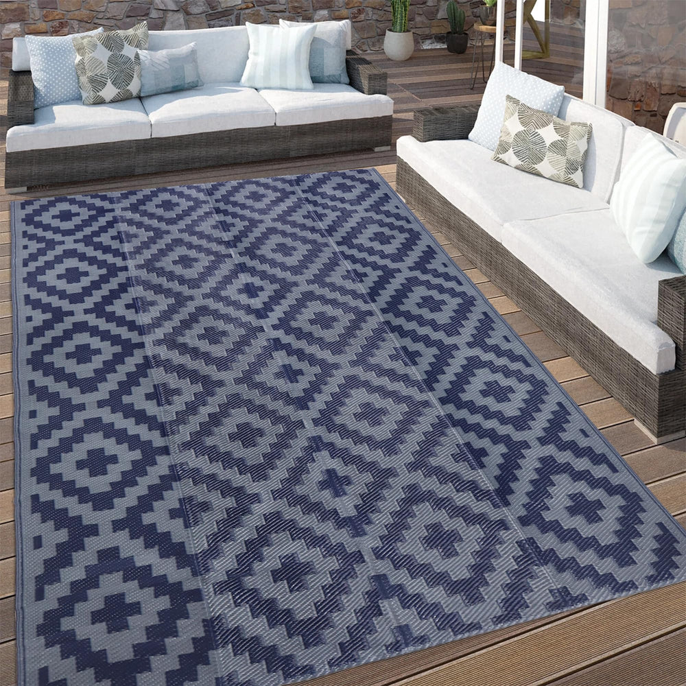 SAND MINE outdoor rug displayed at a picnic
