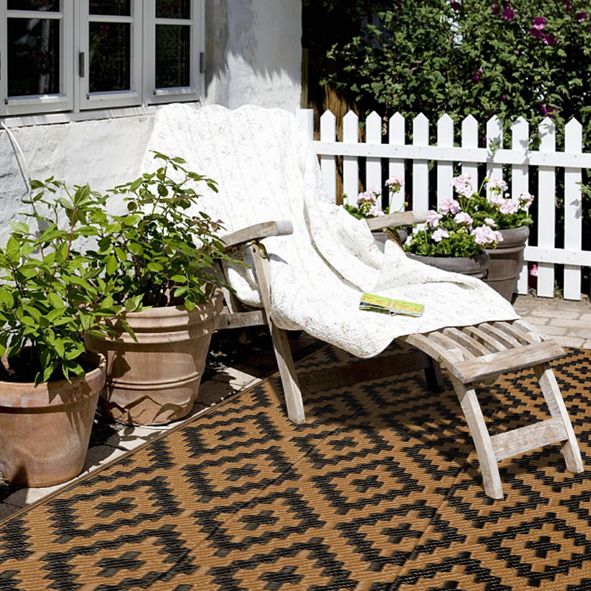 SAND MINE outdoor rug in a backyard setting