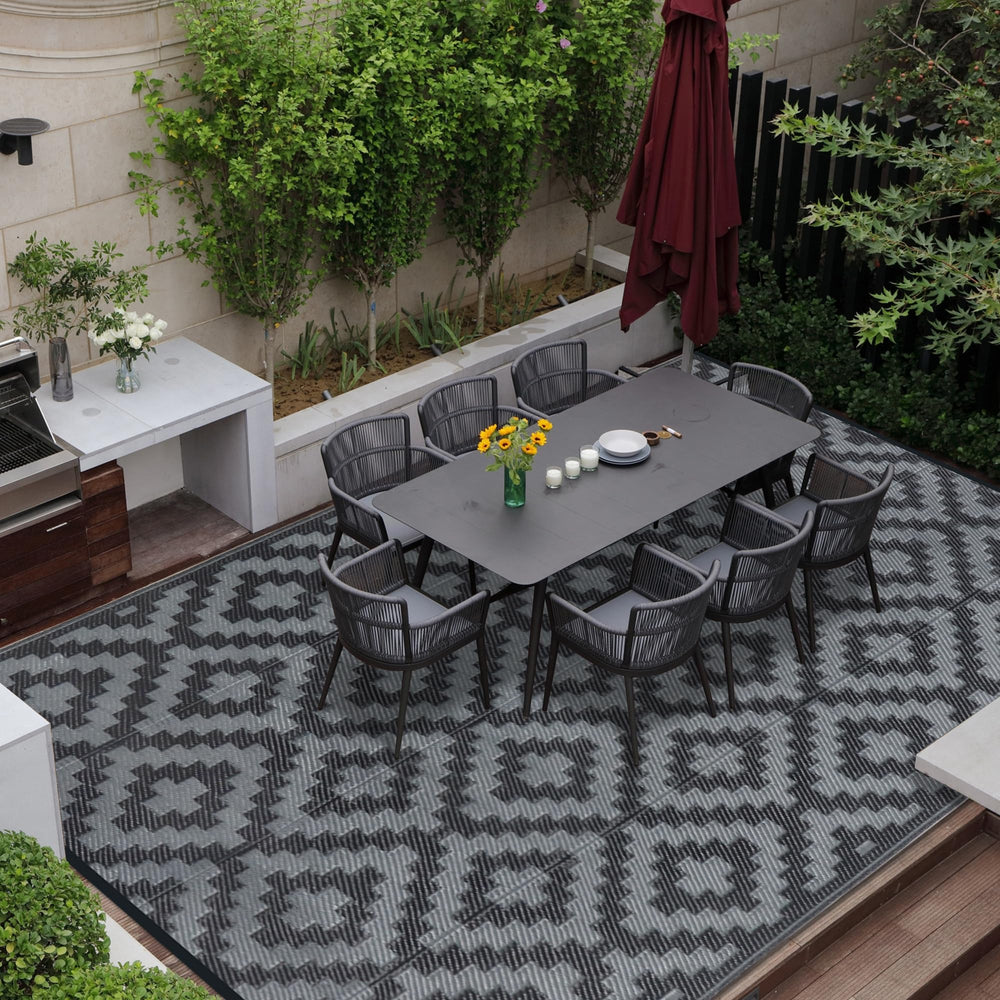 SAND MINE outdoor rug secured with corner loops and stakes