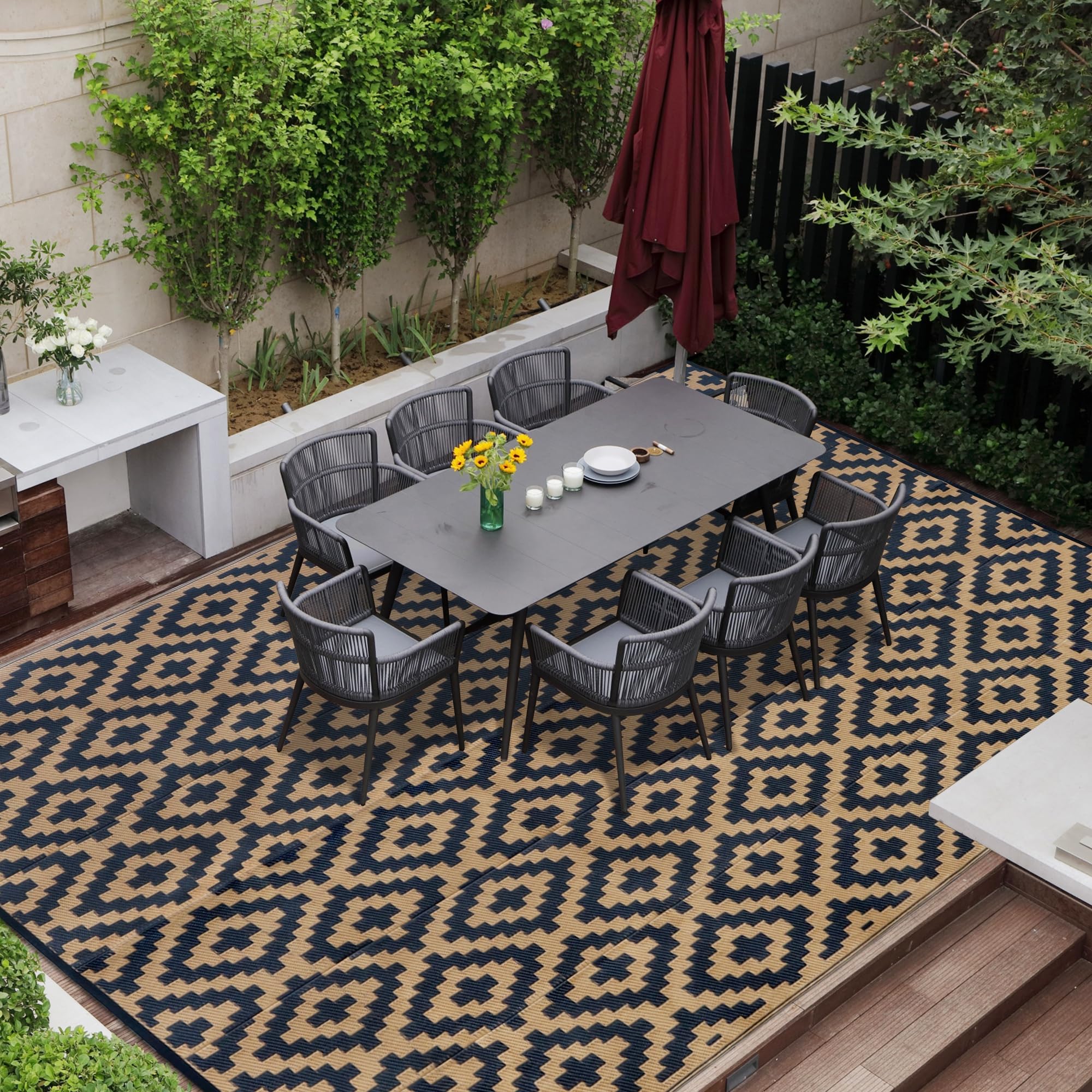 SAND MINE Reversible Mat 8' x 10' in Black & Brown on patio