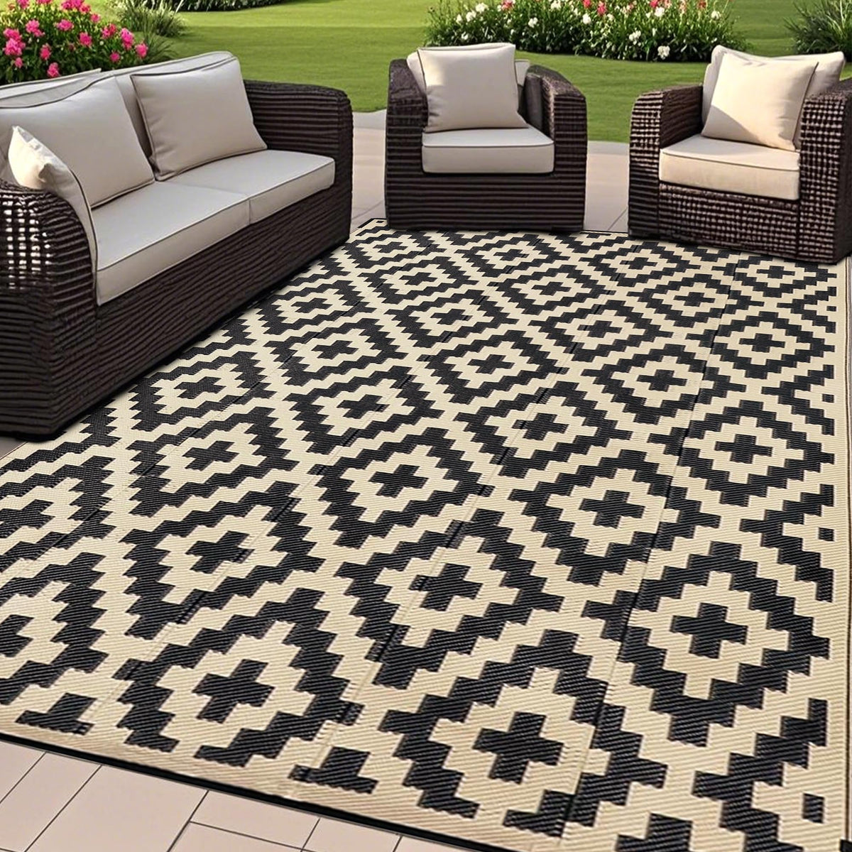 SAND MINE reversible outdoor mat in black and beige, front view