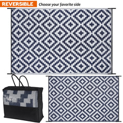 SAND MINE Reversible Outdoor Mat on a patio with furniture