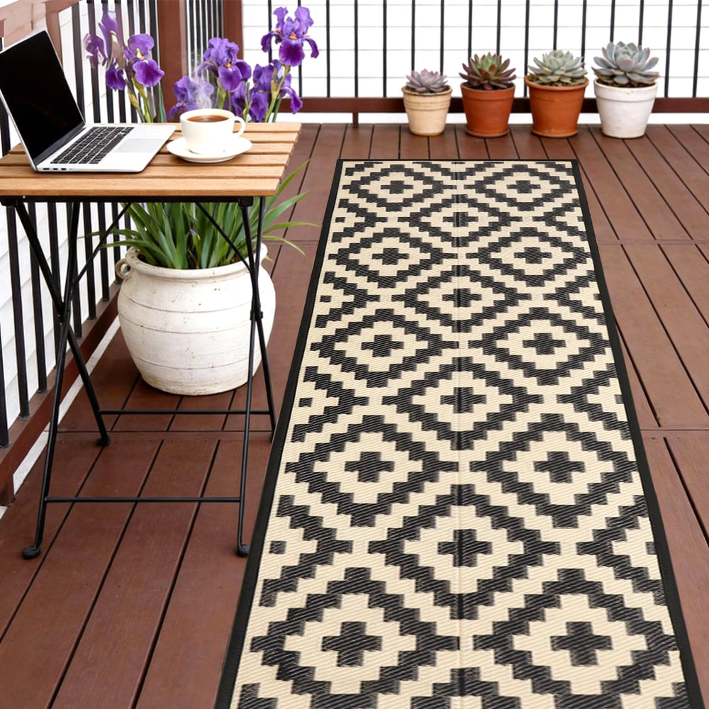 SAND MINE Reversible Outdoor Rug front view, black and beige lattice design