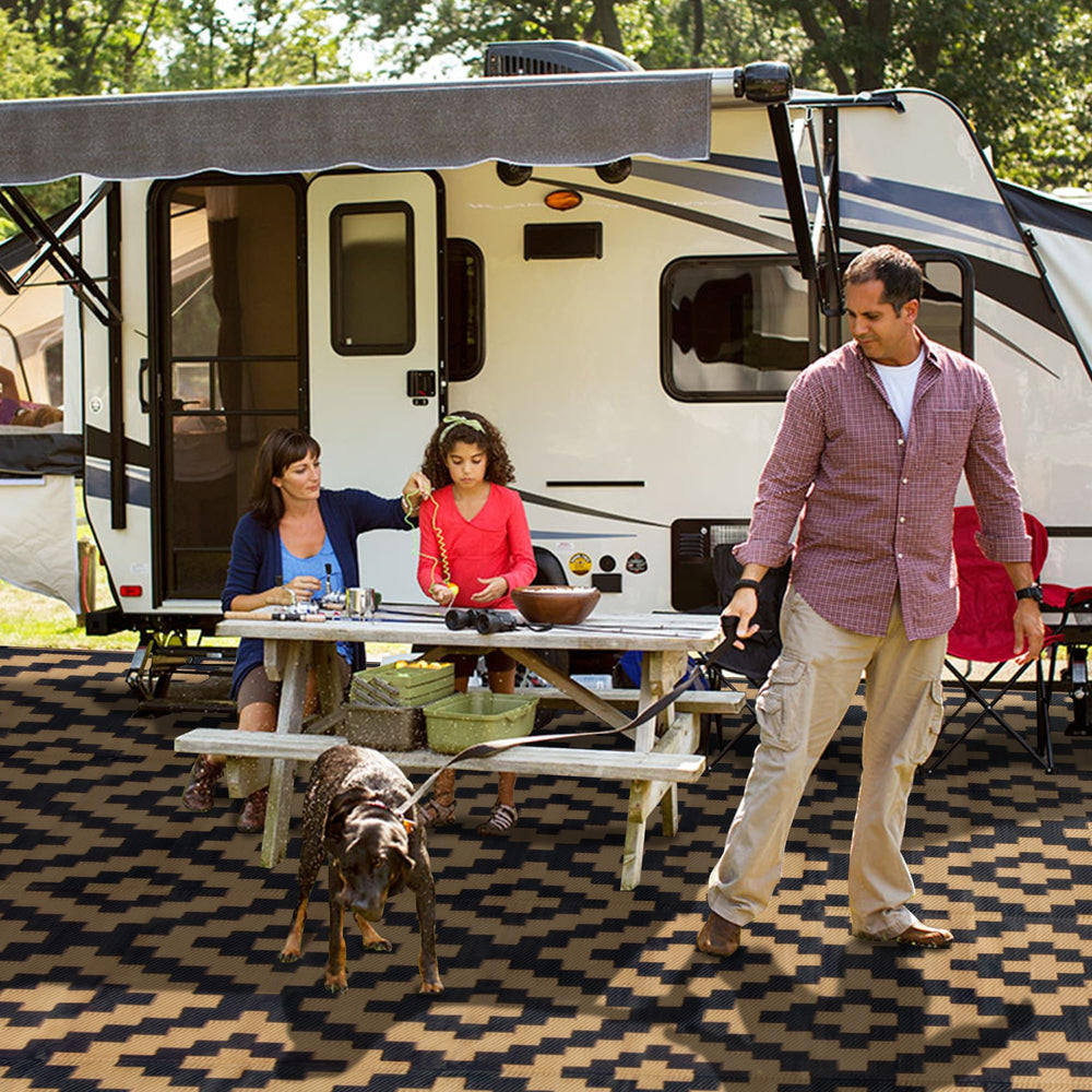 SAND MINE Reversible Outdoor Rug in a camping setting