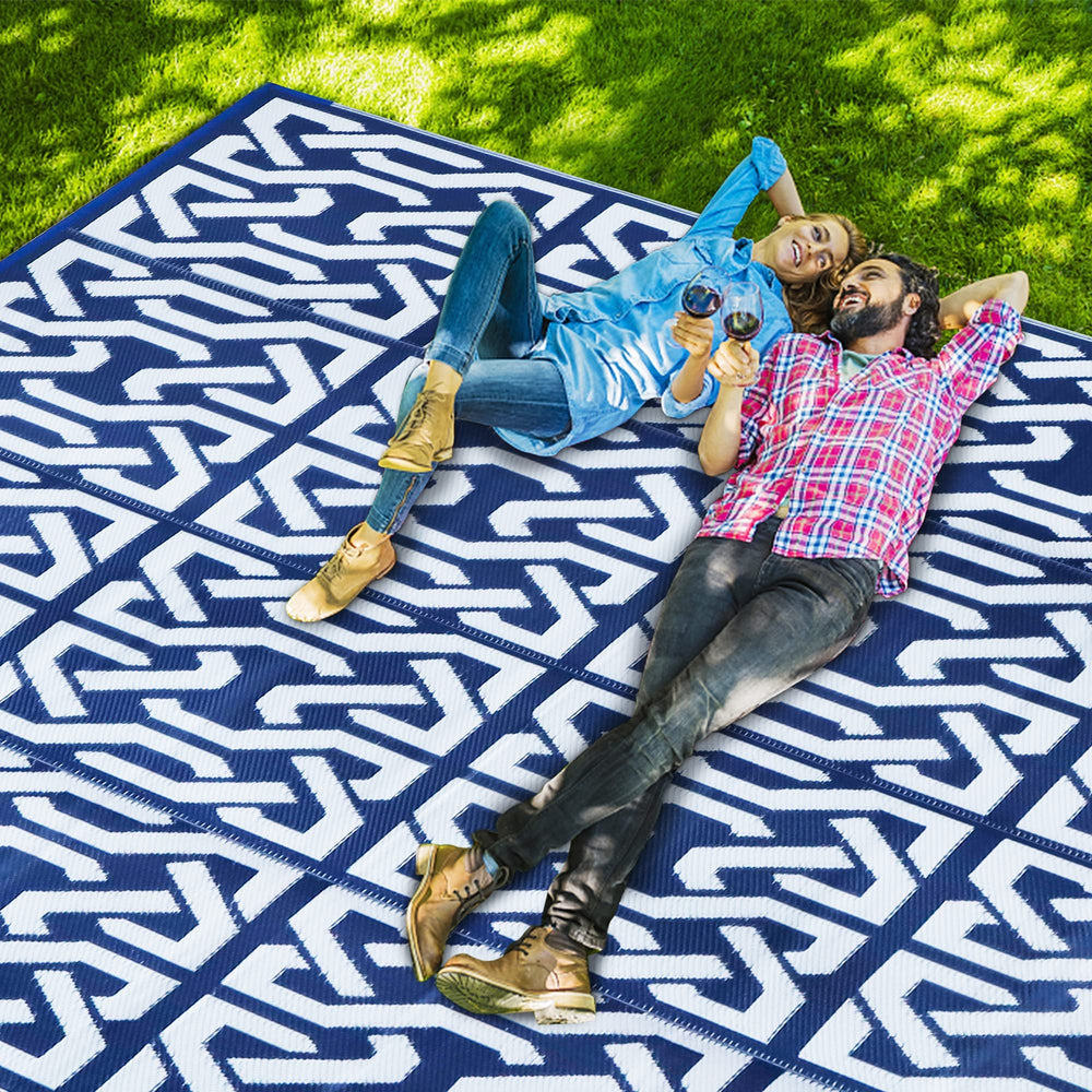 SAND MINE Reversible Outdoor Rug near a camping area