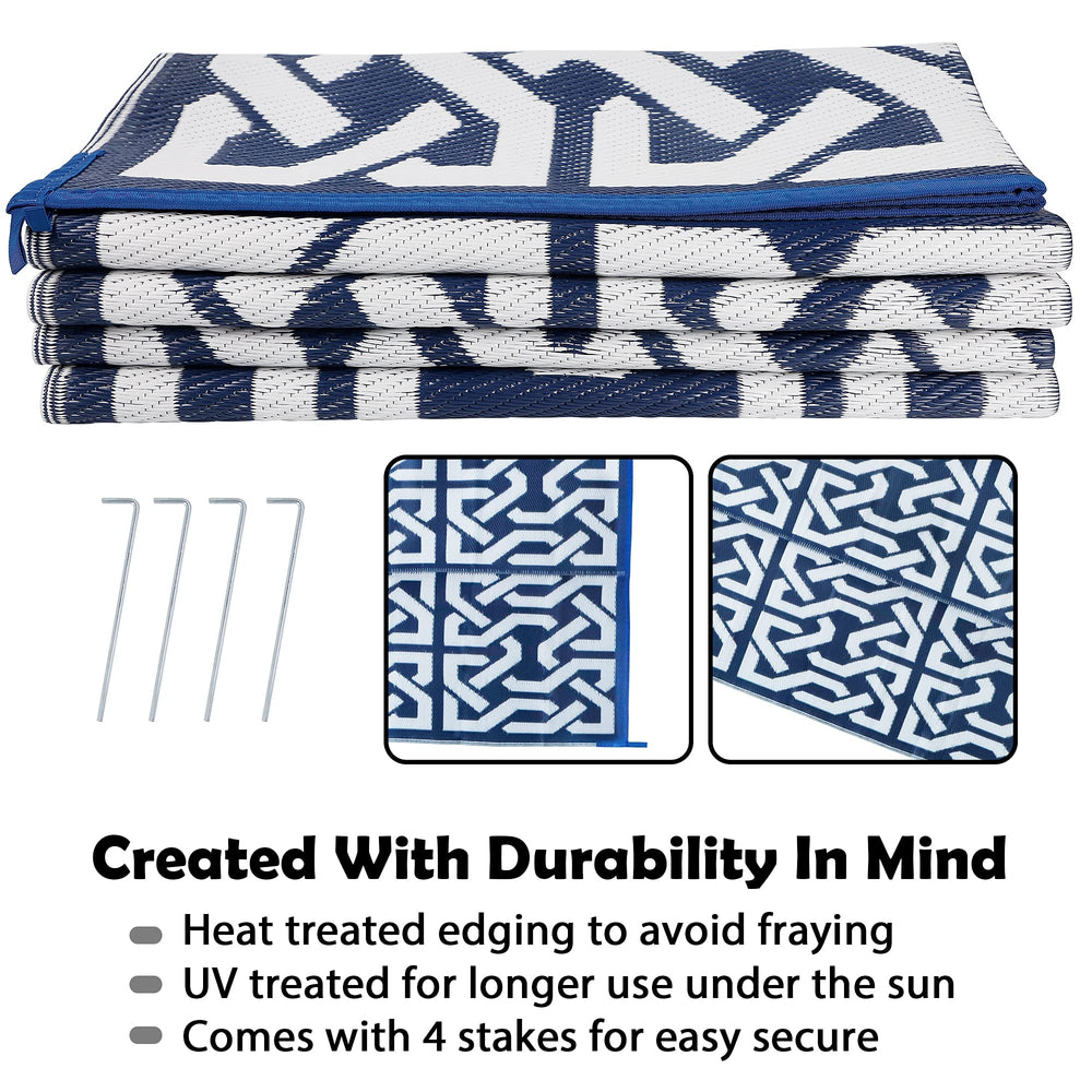 SAND MINE Reversible Outdoor Rug on a patio with furniture