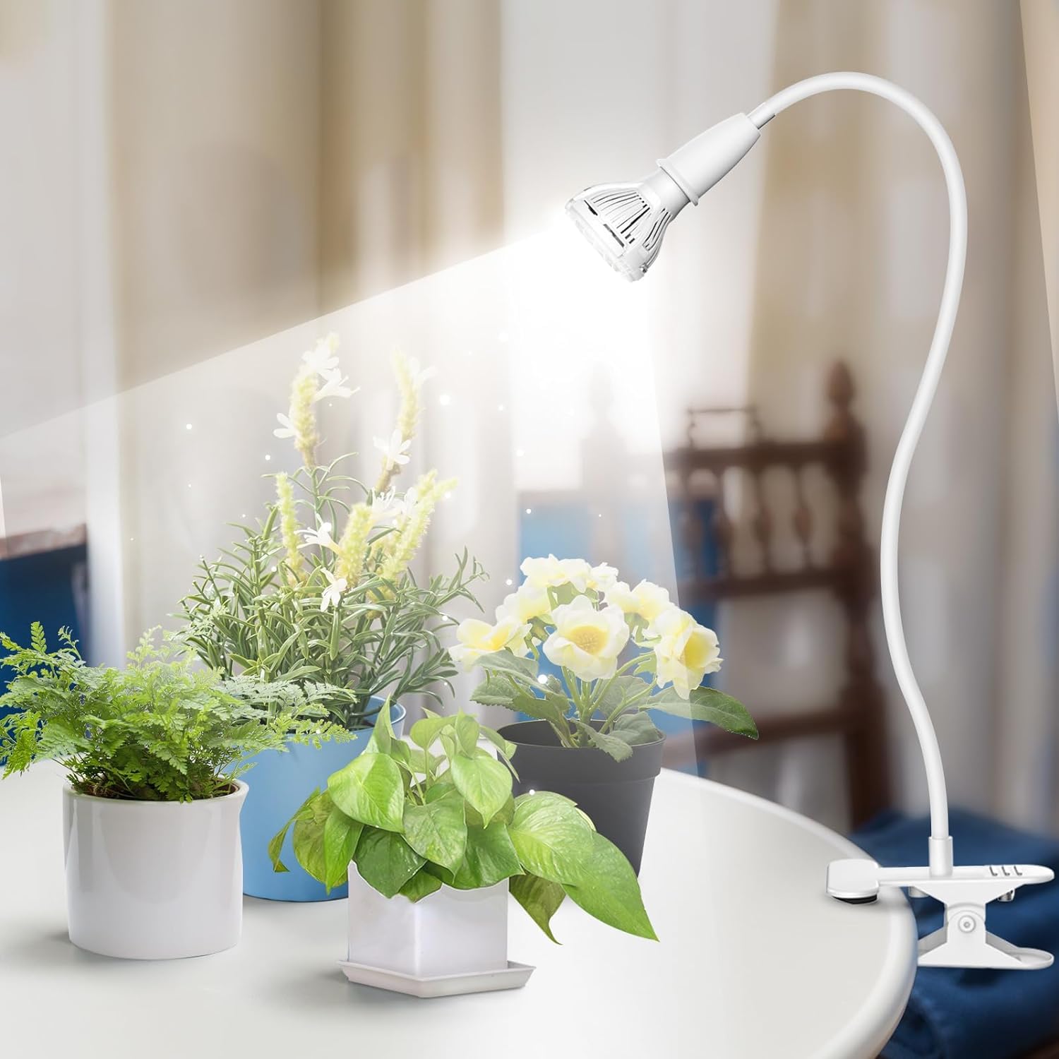SANSI 10W Grow Light on a table with plants