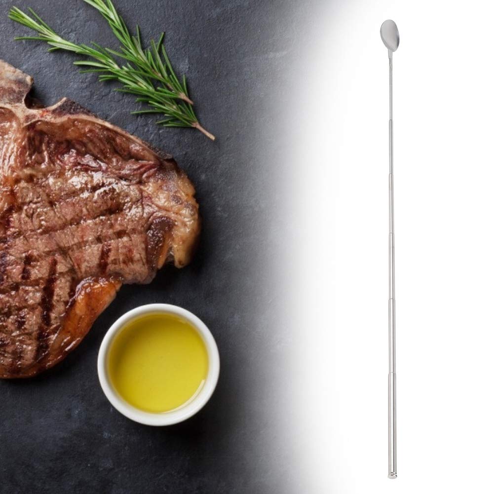 Scene of ORULA Extendable Spoon beside grilled food
