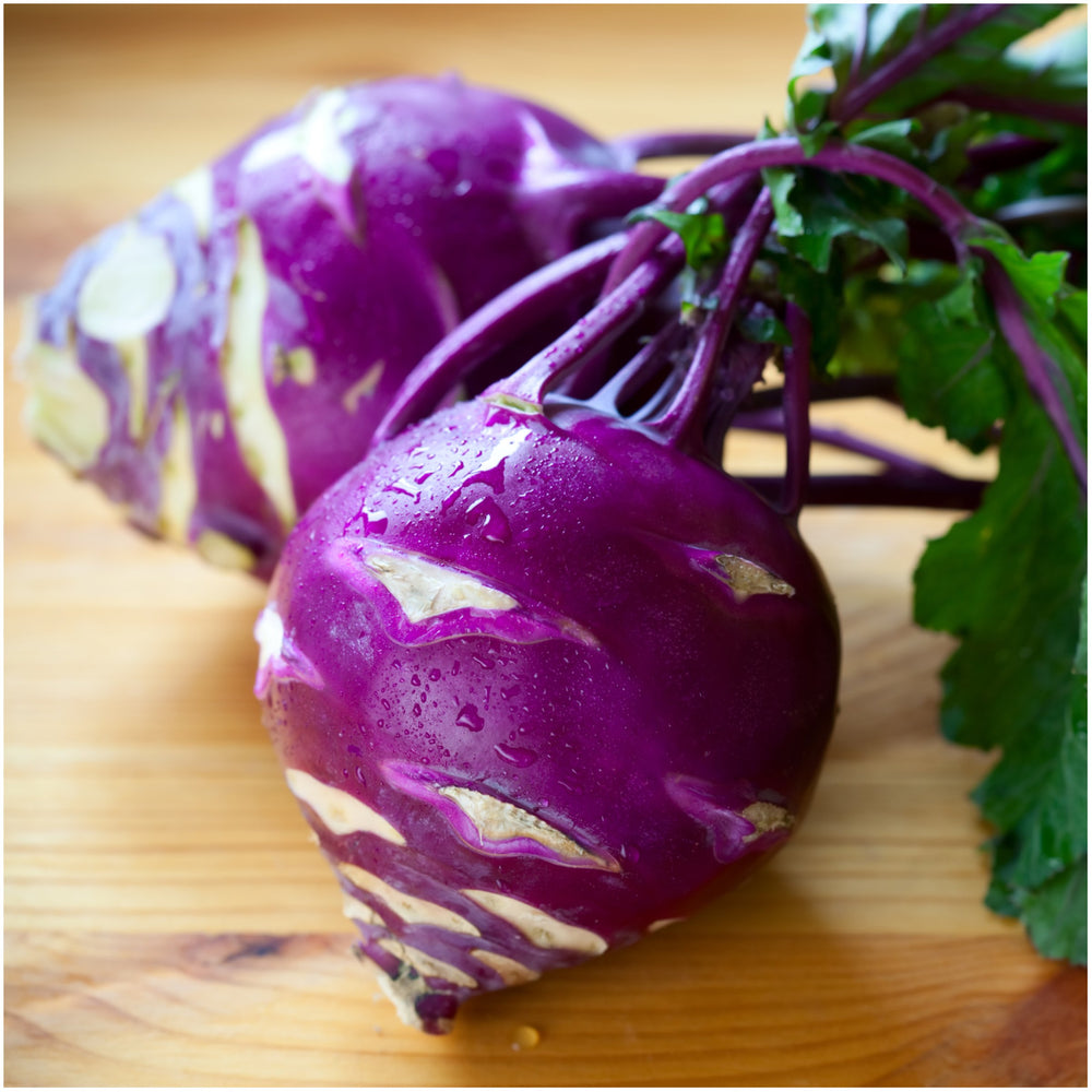 Seed packet of Kohlrabi seeds placed on a gardening table