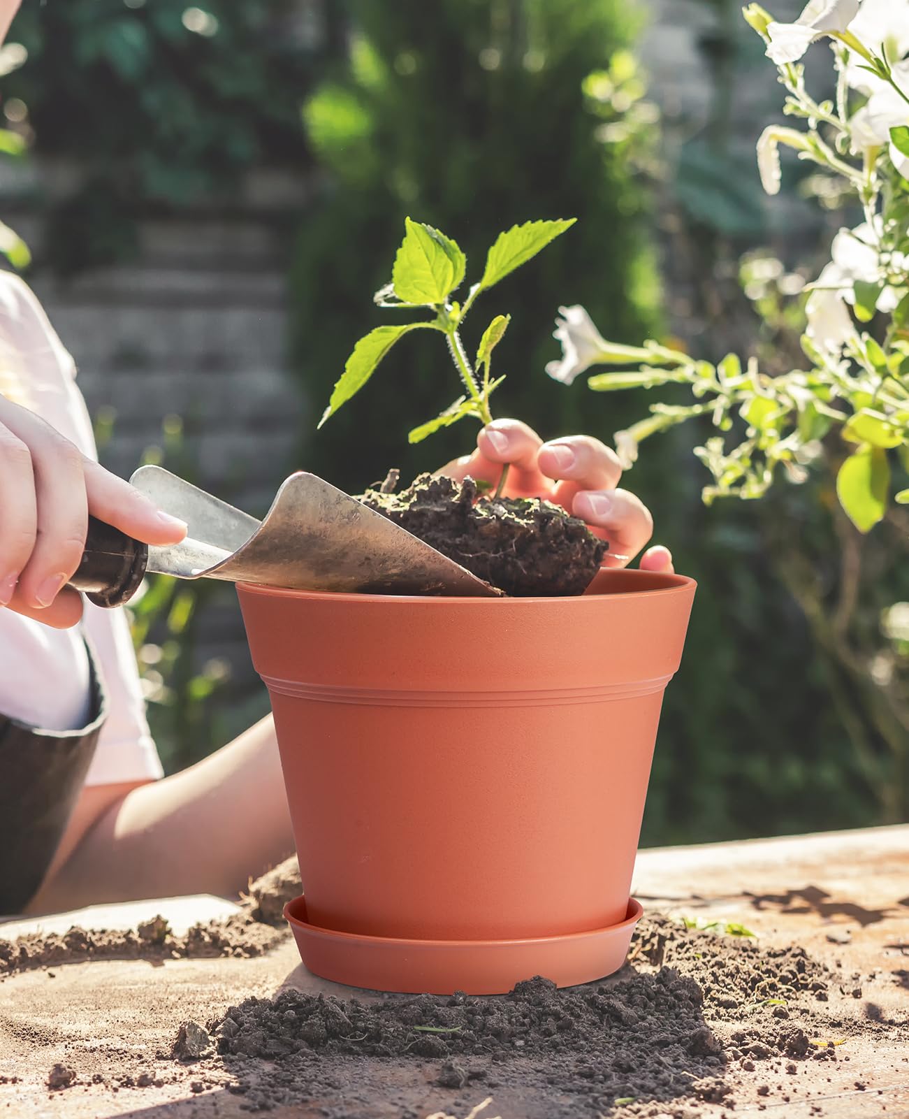 set of 15 homenote 6 Inch Plastic Flower Pots on a garden table