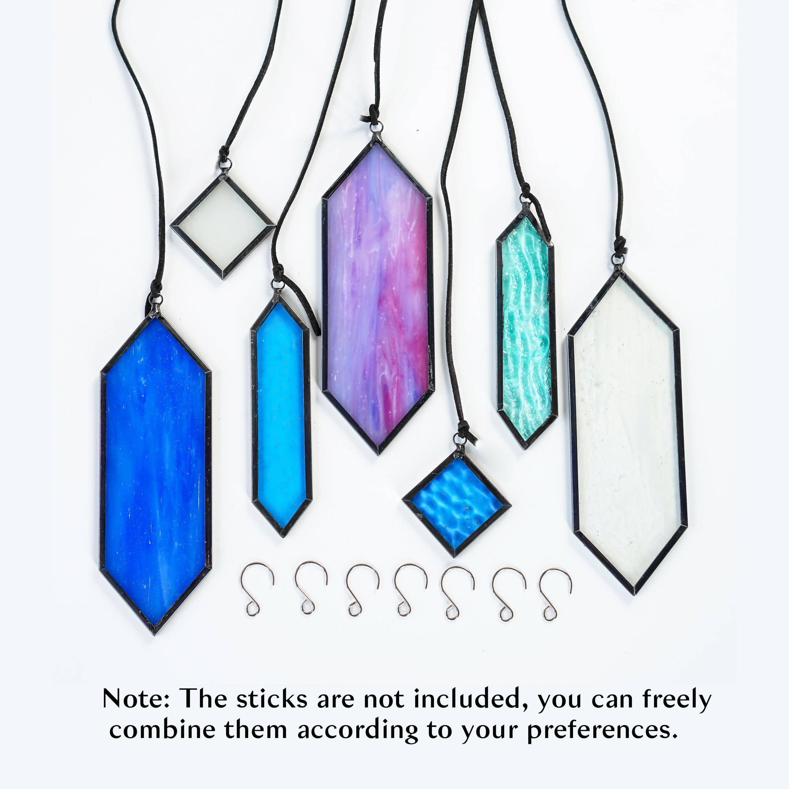 Set of 7 stained glass suncatchers displayed together
