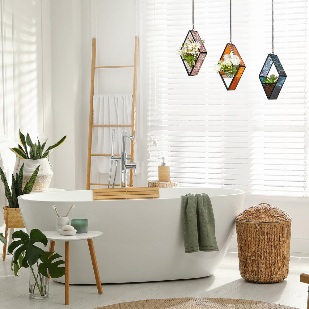 Set of three Yaomiao hanging glass planters on a balcony