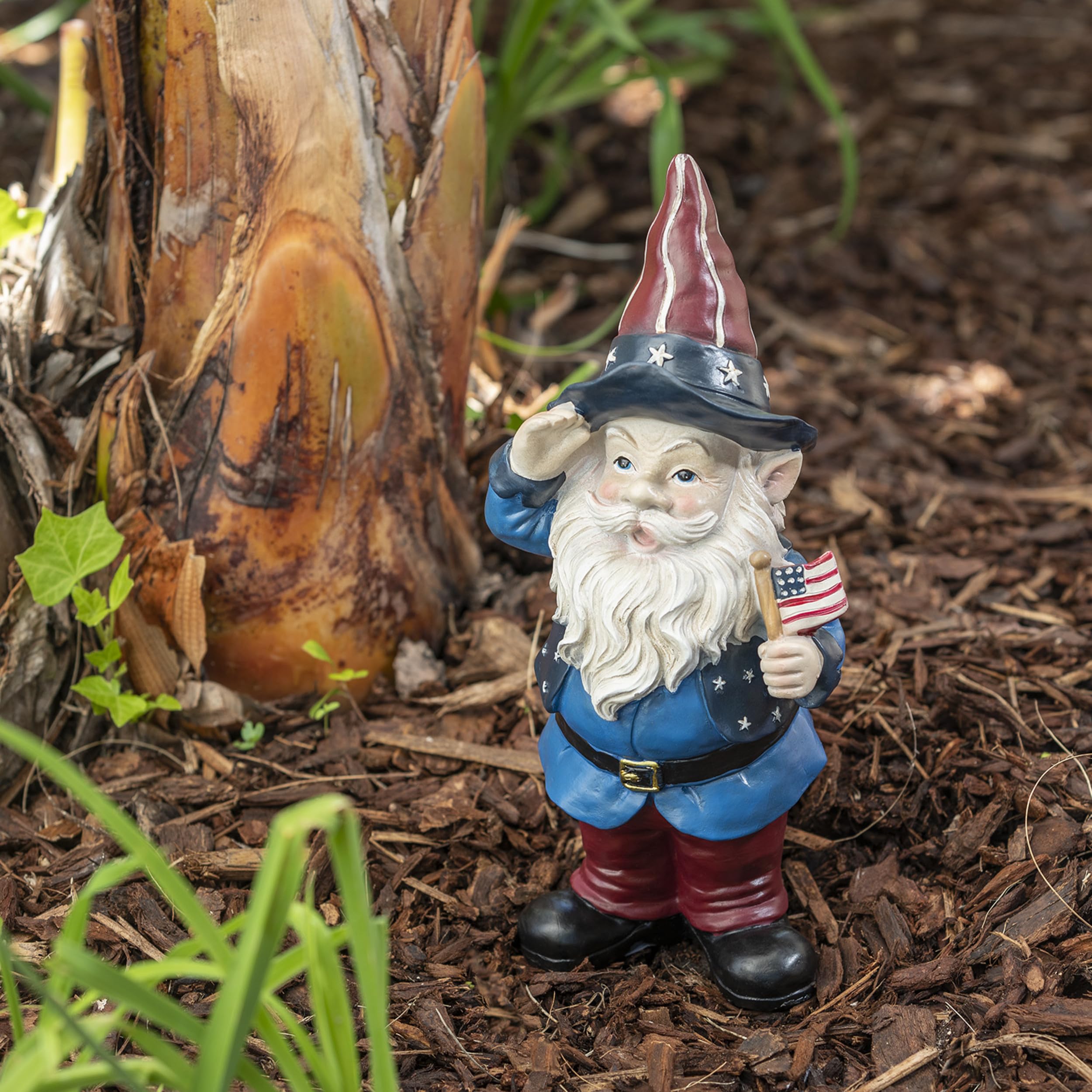 Side view of Alpine Saluting Gnome Statue in garden