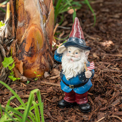 Side view of Alpine Saluting Gnome Statue in garden
