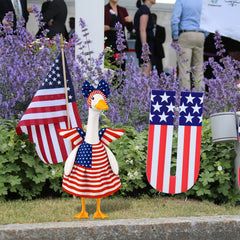 Side view of Aymolas 4th of July goose outfit on a decorative goose
