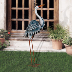 Side view of Blue Heron Sculpture in garden setting