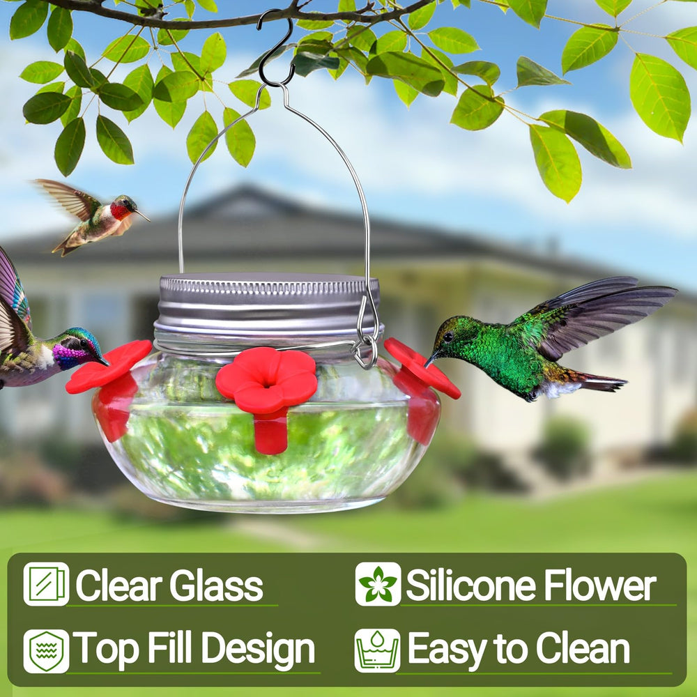 Side view of clear glass hummingbird feeder with metal hanger