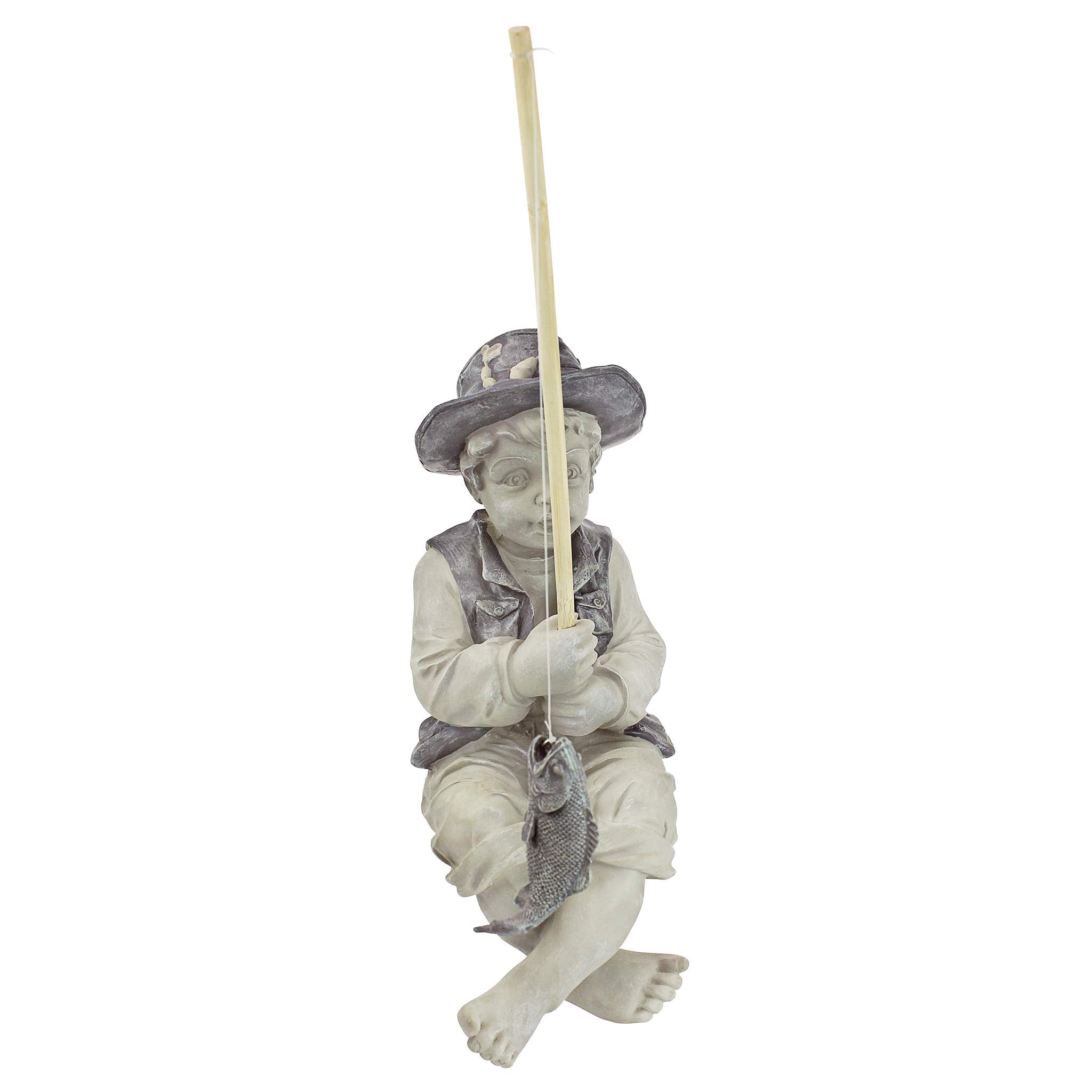 Side view of Frederic the Little Fisherman statue showing detailing
