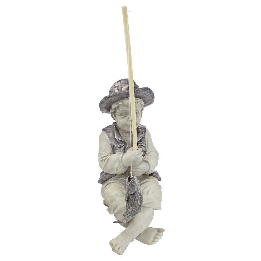 Side view of Frederic the Little Fisherman statue showing detailing