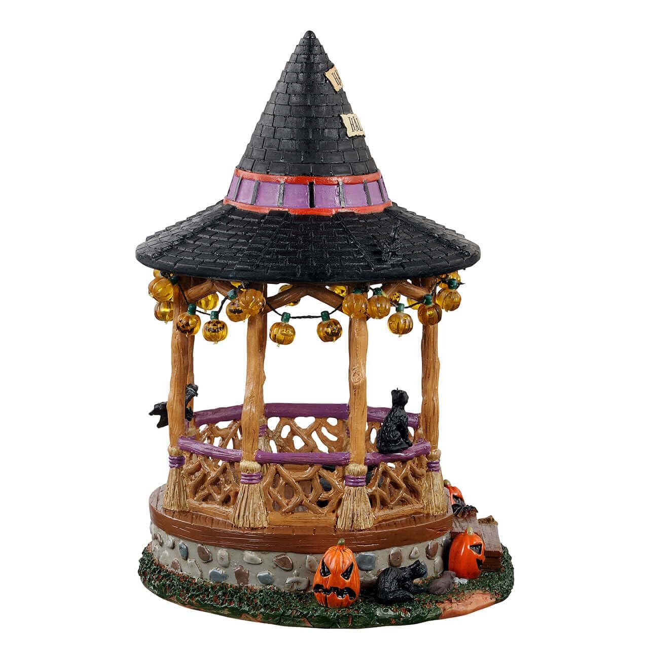 Side view of Lemax Witch Gazebo showing broom columns and pumpkin lights
