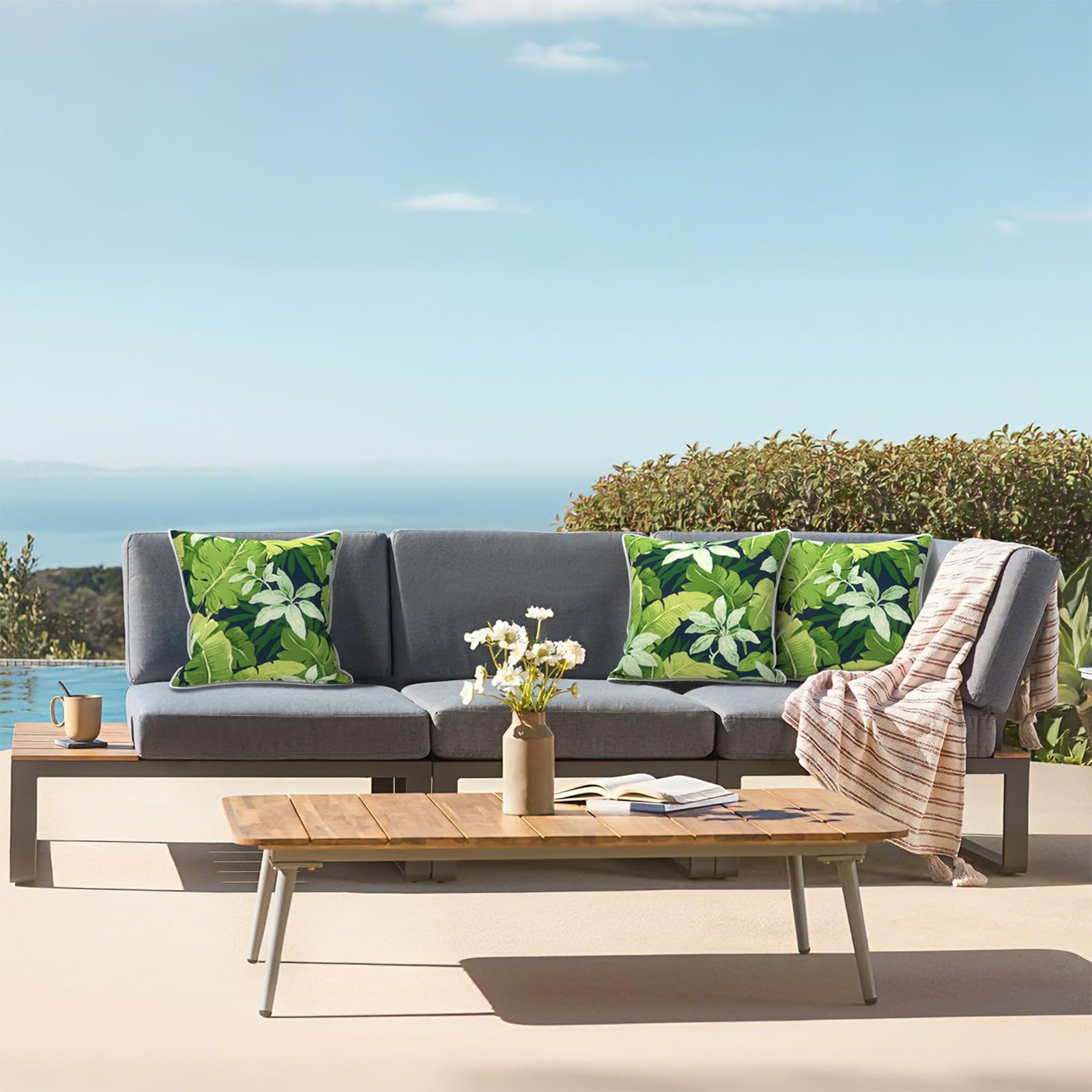Side view of LVTXIII Outdoor Throw Pillows with white piping
