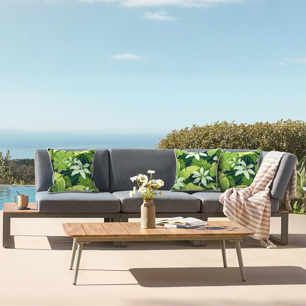 Side view of LVTXIII Outdoor Throw Pillows with white piping