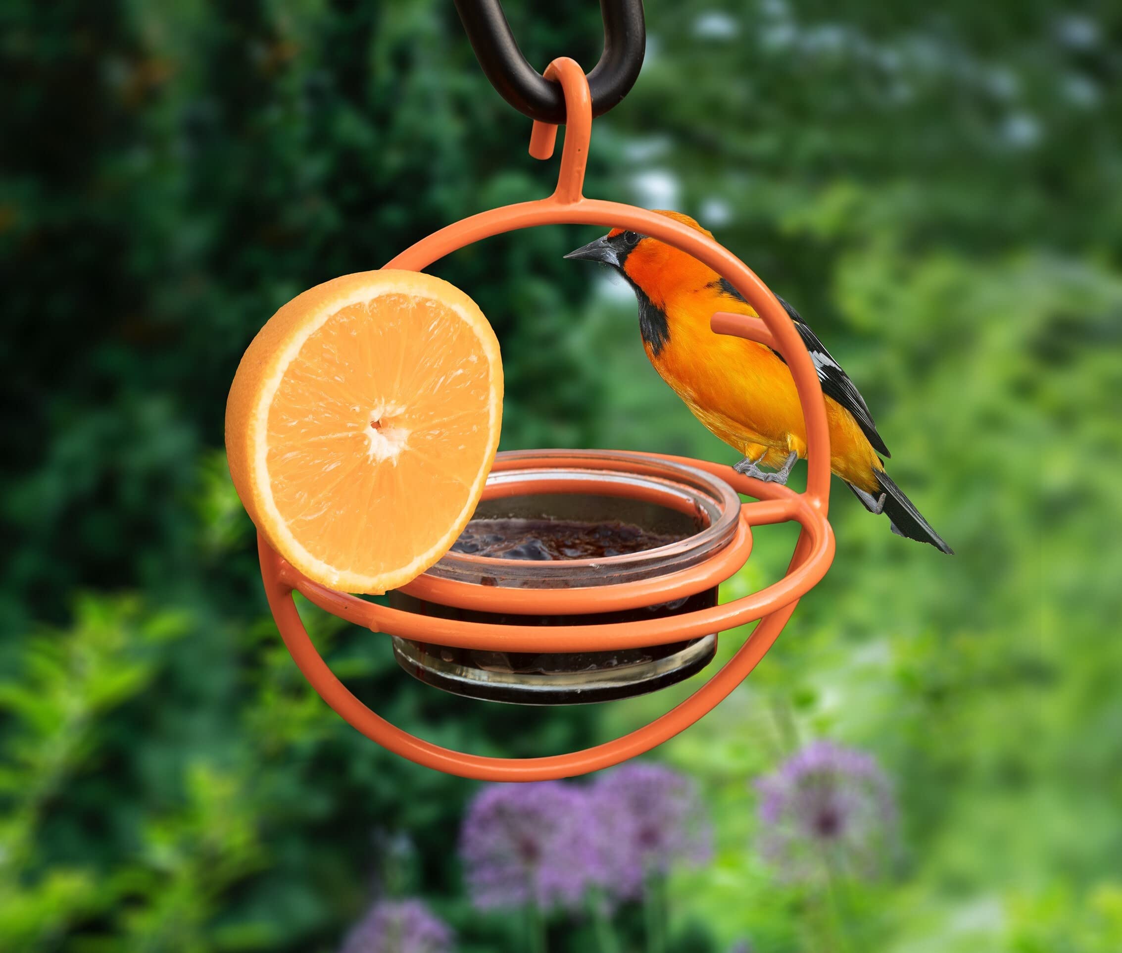 Side view of Monarch Abode Hanging Bird Feeder in a garden