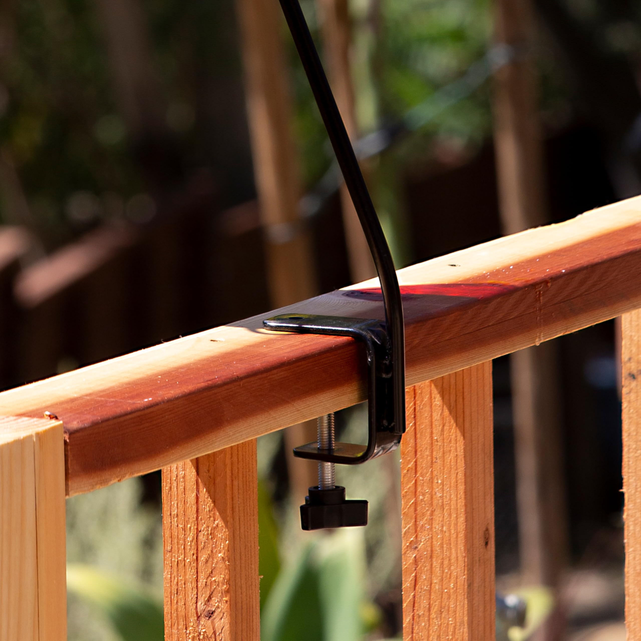Side view of More Birds deck hook showing clamp design