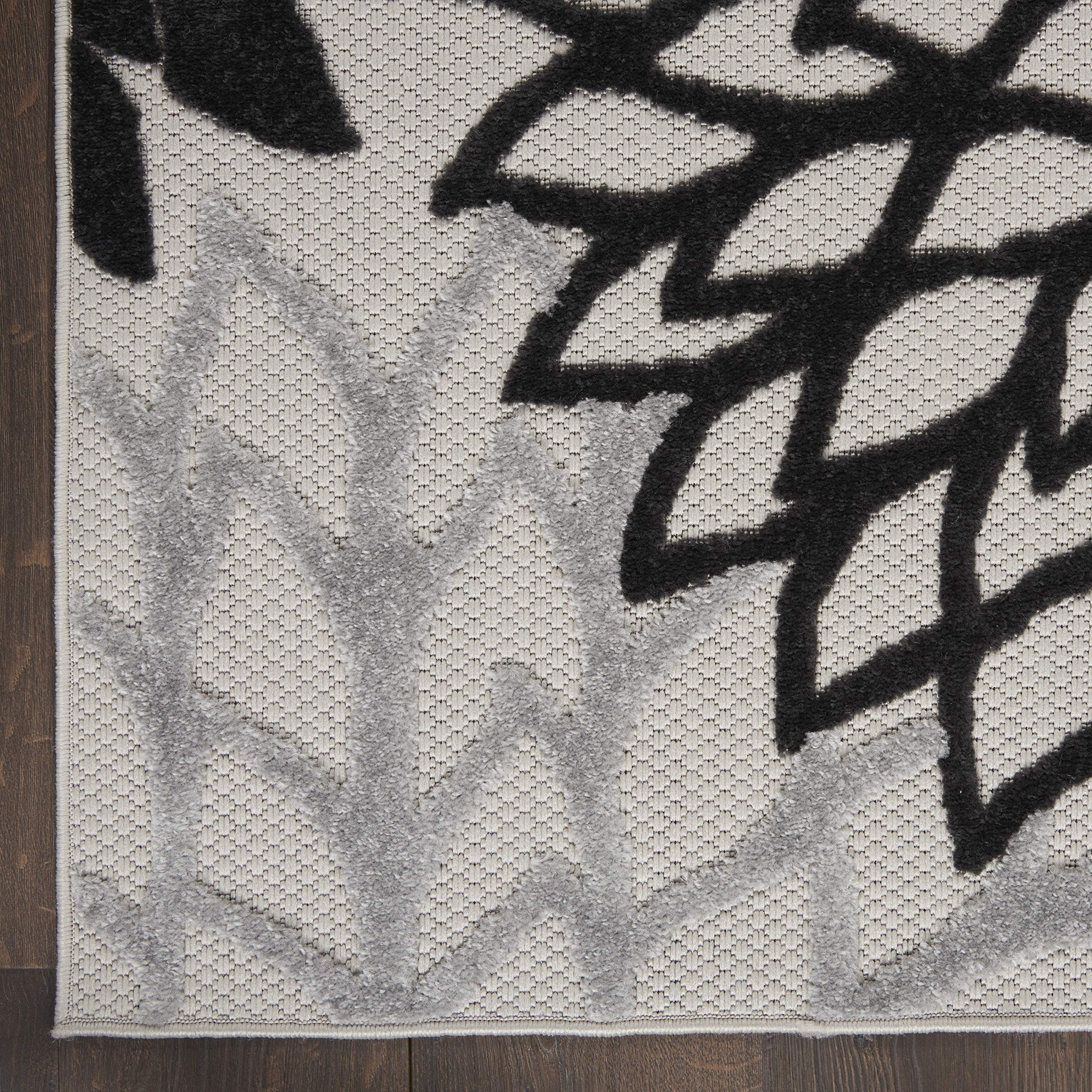Side view of Nourison Aloha area rug showing its flat weave
