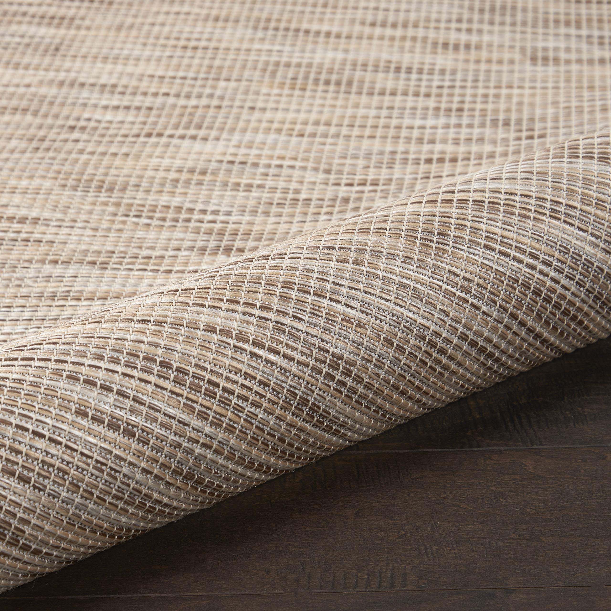 Side view of the Nourison Positano rug showing flat weave