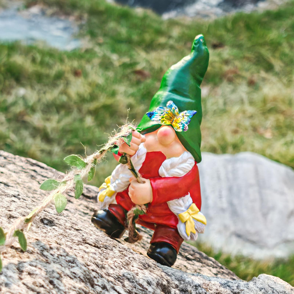 Side view of WONDHOME gnome statue on a tree branch