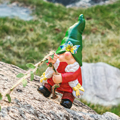 Side view of WONDHOME gnome statue on a tree branch