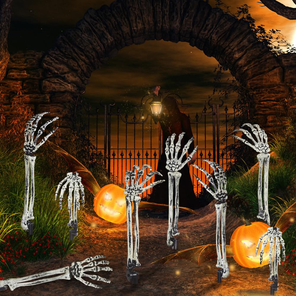 Skeleton arm stake inserted in grass for Halloween decoration