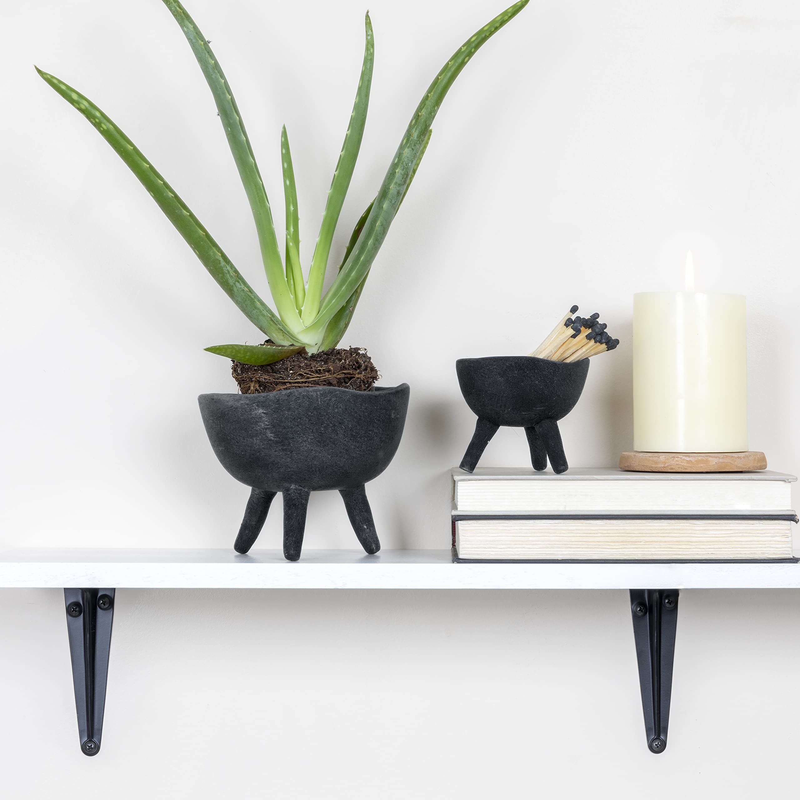Slate grey footed planter with small plant inside