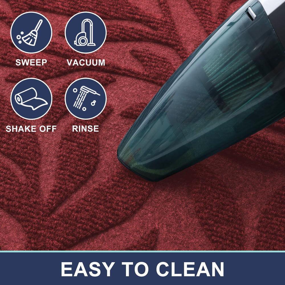 Smiry Leaf Front Door Mat being cleaned with a broom