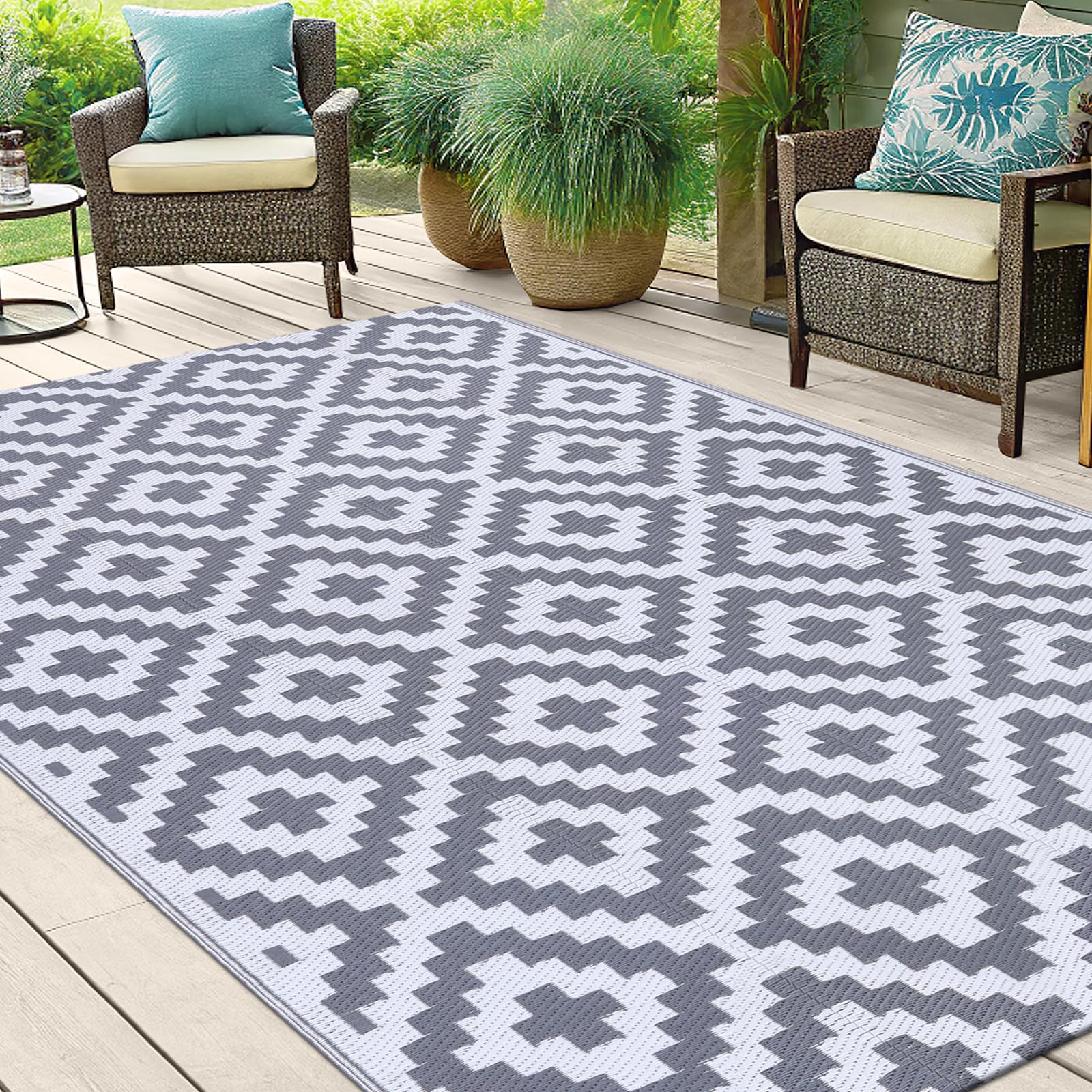 Smiry Outdoor Rug 5x8 ft laid out on a beach picnic