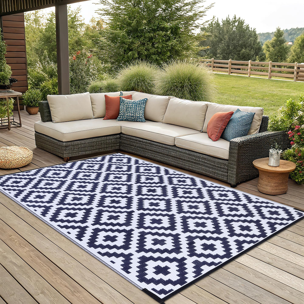 Smiry Outdoor Rug 6x9 ft in a garden environment